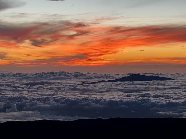 Sunset over the clouds